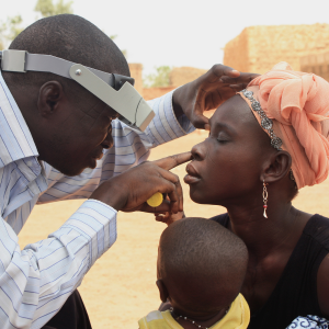 Ophthalmologist examining a patient's eyes