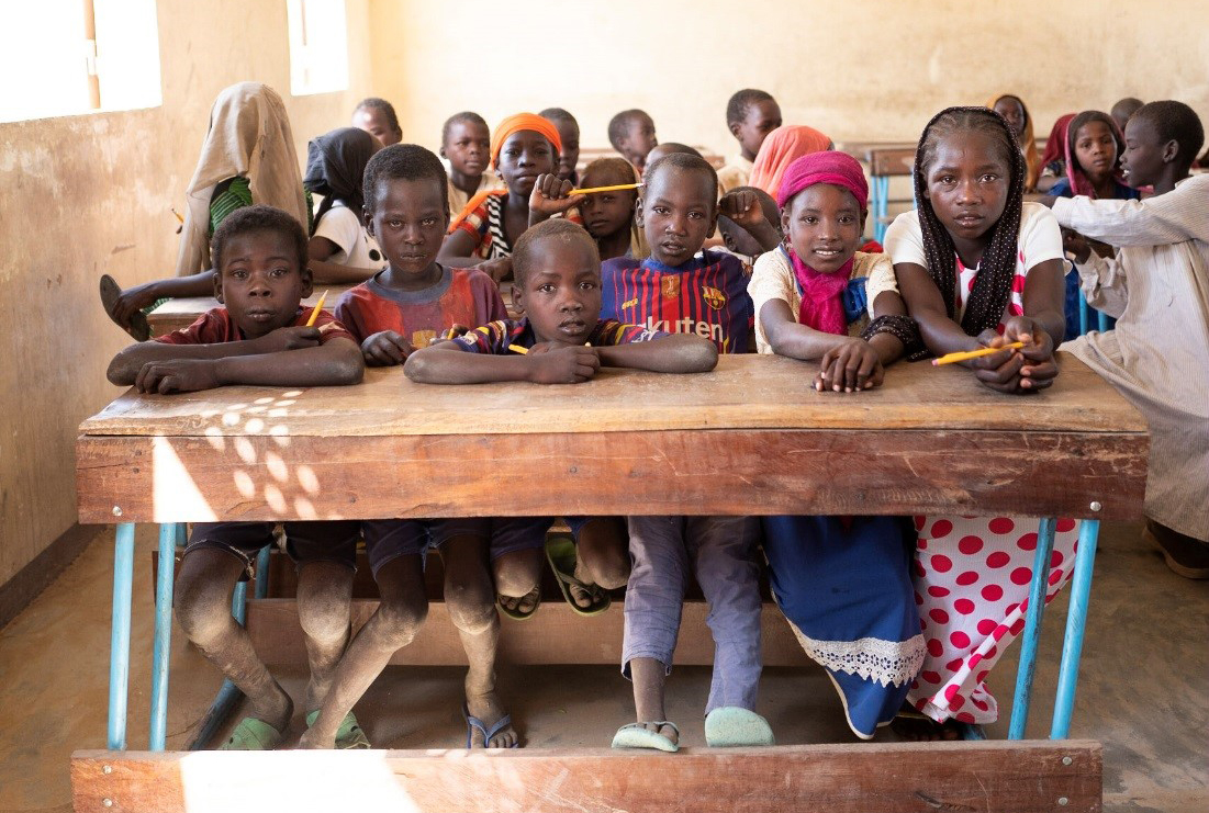 photo of school children in Chad sitting in their classroom; OPIC, Overseas Private Investment Corporation, Finlux Ellen Sarl, off-grid solar project, Chad, financing, development finance, Power Africa, OPIC 2X Women's Initiative, David Bohigian, Sub-Saharan Africa, electricity, economic growth